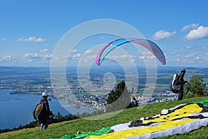 Paraglider over the Zug city, Zugersee and Swiss Alps, Switzerland