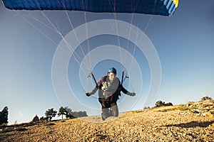 Paraglider is on the paraplane strops