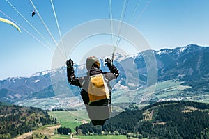 Paraglider is on the paraplane strops - soaring flight moment