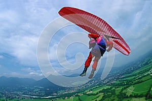 Paraglider pilot in a curve over Lenggries