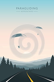 Paraglider in the sky on road and mountain background photo