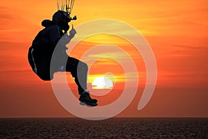 Paraglider at sunset