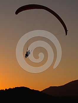 Paraglider at sunset