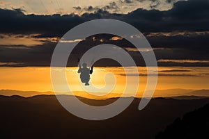 Paraglider at sunset
