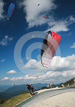 Paraglider taking-off in the Alps