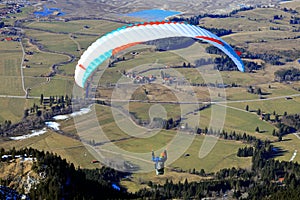 Paraglider on Tegelberg mountain. Bavaria, Germany, Europe.