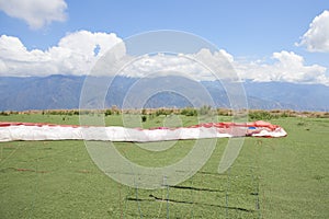 Paraglider wing extended on the ground, prior to a flight