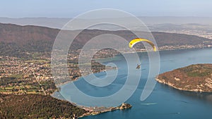 Paragliders above Lake Annecy, in autumn, in Haute Savoie, France