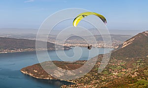 Paragliders above Lake Annecy, in autumn, in Haute Savoie, France