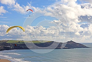 Paragliders above Whitsand Bay