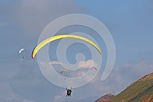 Paragliders flying above Rhossili