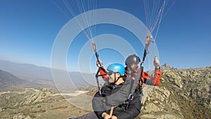 Paragliders over rocky mountain