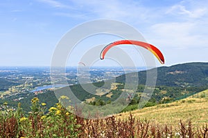 Paragliders start their flight on Zar mountain in Poland photo