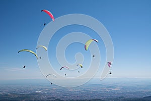 Paragliders thermalling in Puy de Dome, Auvergne, French Massif Central. France