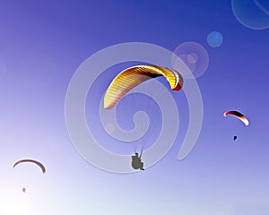 Paragliding in a blue sky
