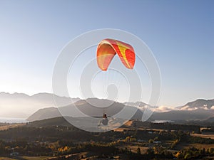 Paragliding above mountain scenery photo