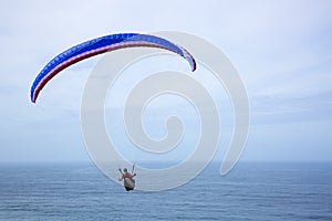 Paragliding above the ocean