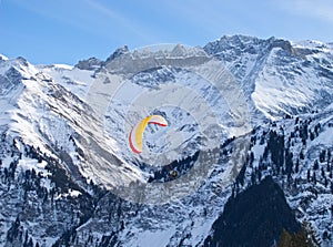 Paragliding in alps mountains
