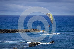 Paragliding in blue sky over Puerto de la Cruz on Tenerife