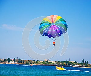 Paragliding in the clear sky