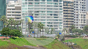 Paragliding on a cliff in Parque del Amor or Park of Love in Miraflores district timelapse. Lima, Peru photo