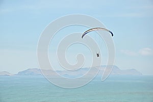 Paragliding by the coastline in Lima, Peru