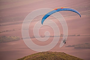 Freedom paragliding in colors of ongoing sunset photo