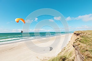 Paragliding on the deserted beach