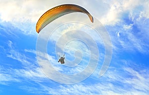 Paragliding extreme Sport with blue Sky and clouds on background