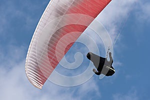 Paragliding extreme sport with blue sky and clouds