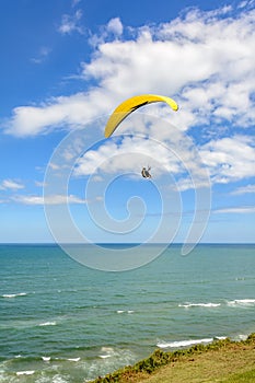 Paragliding flight over the sea