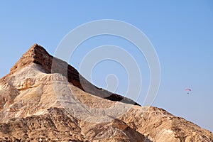 Paragliding in Negev desert mountains.