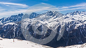 Paragliding over Alps with mountain cliffs covered with snow in Karnten Austria.