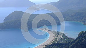 Paragliding over the Blue Lagoon Oludeniz over the sea and mountains in turkey