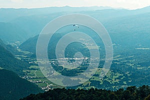 Paragliding over Lake Bohinj valley in summer