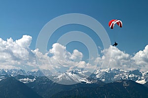Paragliding over mountains photo