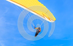 Paragliding over the mountains in winter. Ski resort Hopfgarten