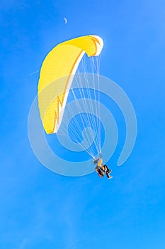 Paragliding over the mountains in winter. Ski resort Hopfgarten