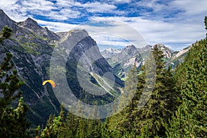 Paragliding over the pralognan mountains in the Vanoise National Park photo