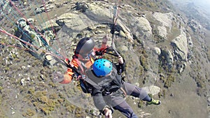 Paragliding over rocky mountain