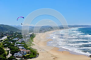Paragliding over Wilderness beach on the Garden Route, South Africa photo