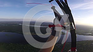 Paragliding panorama in sunset above the city.