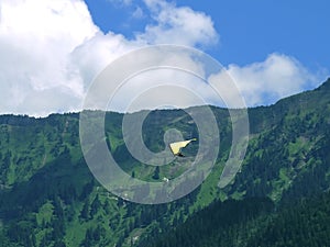 Paragliding, parachute over the mountain