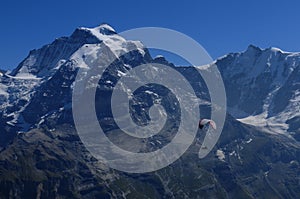 Paragliding from Schilthornwith view to Eiger, MÃÂ¶nch and Jungfrau in the swiss alps