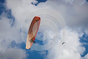 Paragliding on the sky above the sea photo