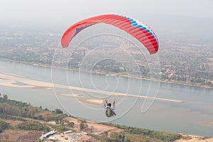 Paragliding in the sky. Paraglider  flying over Landscape from Beautiful View Mekong River