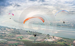 Paragliding in the sky. Paraglider  flying over Landscape from Beautiful View Mekong River