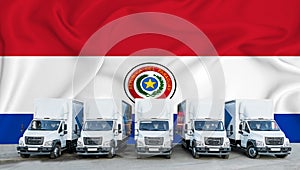 Paraguai flag in the background. Five new white trucks are parked in the parking lot. Truck, transport, freight transport. Freight photo