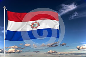 Paraguai national flag waving in the wind against deep blue sky.  International relations concept photo