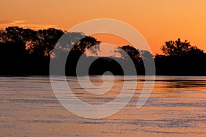 Paraguay River at sunset between Corumba and Porto Jofre, Pantanal, Mato Grosso do Sul, Brazil photo